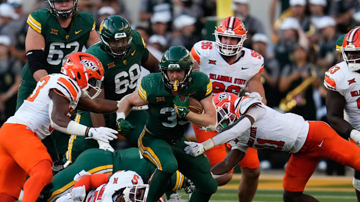 Oct 26, 2024; Waco, Texas, USA; Baylor Bears running back Dawson Pendergrass (35) runs the ball against the Oklahoma State Cowboys during the first half at McLane Stadium. Mandatory Credit: Chris Jones-Imagn Images Oct 26, 2024; Waco, Texas, USA; Baylor Bears running back Dawson Pendergrass (35) runs the ball against the Oklahoma State Cowboys during the first half at McLane Stadium. Mandatory Credit: Chris Jones-Imagn Images