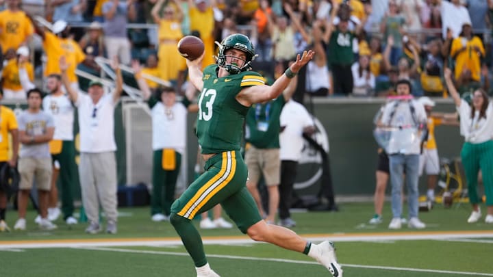 Oct 26, 2024; Waco, Texas, USA; Baylor Bears quarterback Sawyer Robertson (13) celebrates after scoring a 41 yard touchdown  against the Oklahoma State Cowboys during the second half at McLane Stadium. Mandatory Credit: Chris Jones-Imagn Images
