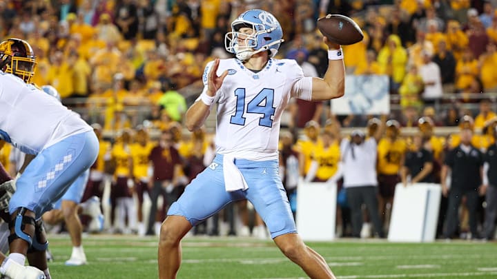 Aug 29, 2024; Minneapolis, Minnesota, USA; North Carolina Tar Heels quarterback Max Johnson (14) throws the ball against the Minnesota Golden Gophers during the first half at Huntington Bank Stadium. 