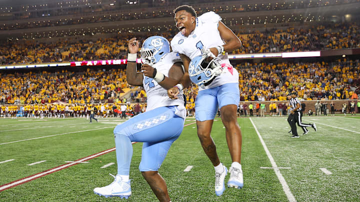 Aug 29, 2024; Minneapolis, Minnesota, USA; North Carolina Tar Heels defensive lineman Travis Shaw (4) and wide receiver Jordan Shipp (1) celebrate their teams win against the Minnesota Golden Gophers after the game at Huntington Bank Stadium. Mandatory Credit: Matt Krohn-Imagn Images Aug 29, 2024; Minneapolis, Minnesota, USA; North Carolina Tar Heels defensive lineman Travis Shaw (4) and wide receiver Jordan Shipp (1) celebrate their teams win against the Minnesota Golden Gophers after the game at Huntington Bank Stadium. Mandatory Credit: Matt Krohn-Imagn Images