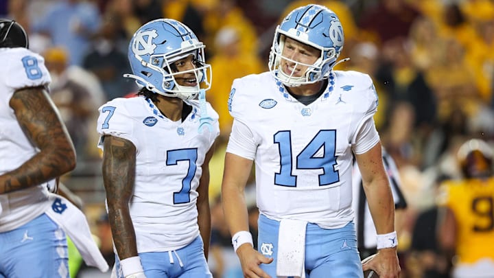 Aug 29, 2024; Minneapolis, Minnesota, USA; North Carolina Tar Heels quarterback Max Johnson (14) celebrates his rushing touchdown against the Minnesota Golden Gophers during the first half at Huntington Bank Stadium. Aug 29, 2024; Minneapolis, Minnesota, USA; North Carolina Tar Heels quarterback Max Johnson (14) celebrates his rushing touchdown against the Minnesota Golden Gophers during the first half at Huntington Bank Stadium.