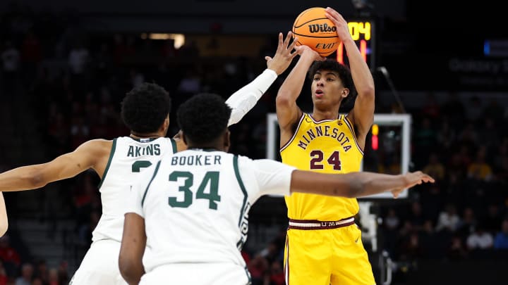 Mar 14, 2024; Minneapolis, MN, USA; Minnesota Golden Gophers guard Cam Christie (24) shoots as Michigan State Spartans guard Jaden Akins (3) defends during the second half at Target Center. Mandatory Credit: Matt Krohn-USA TODAY Sports