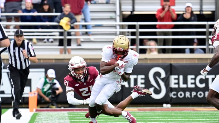 Sep 16, 2023; Chestnut Hill, Massachusetts, USA; Boston College Eagles wide receiver Ryan O'Keefe (4) runs the ball while being chased down by Florida State Seminoles defensive back Greedy Vance Jr. (21) during the second half at Alumni Stadium. Mandatory Credit: Eric Canha-USA TODAY Sports