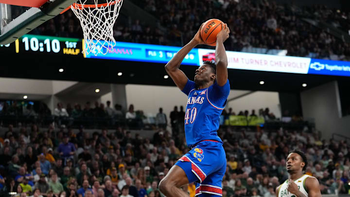 Feb 1, 2025; Waco, Texas, USA;  Kansas Jayhawks forward Flory Bidunga (40) dunks the ball against the Baylor Bears during the first half at Paul and Alejandra Foster Pavilion. Mandatory Credit: Chris Jones-Imagn Images