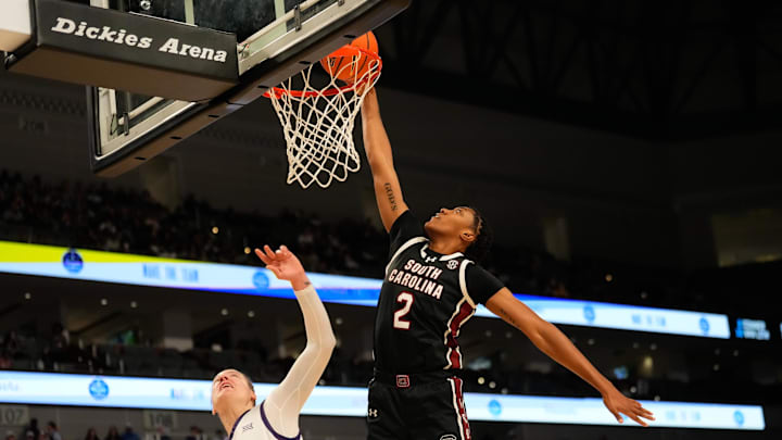 Dec 8, 2024; Fort Worth, Texas, USA;  South Carolina Gamecocks forward Ashlyn Watkins (2) dunks the ball against TCU Horned Frogs center Sedona Prince (13) during the first half at Dickies Arena. Mandatory Credit: Chris Jones-Imagn Images