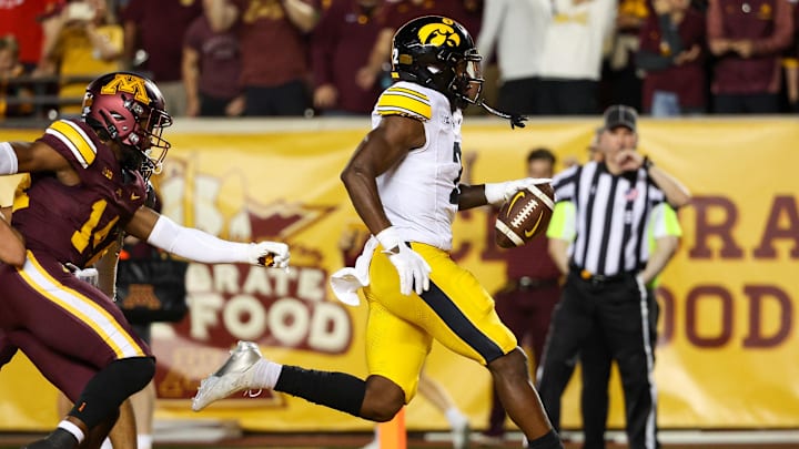 Sep 21, 2024; Minneapolis, Minnesota, USA; Iowa Hawkeyes running back Kaleb Johnson (2) runs for a touchdown against the Minnesota Golden Gophers during the second half at Huntington Bank Stadium.