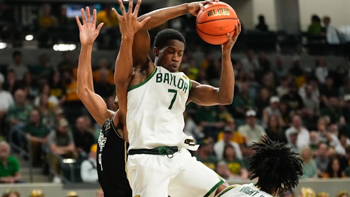 Feb 8, 2025; Waco, Texas, USA; Baylor Bears guard VJ Edgecombe (7) grabs a rebound against UCF Knights guard Keyshawn Hall (4) during the first half at Paul and Alejandra Foster Pavilion. Mandatory Credit: Chris Jones-Imagn Images Feb 8, 2025; Waco, Texas, USA; Baylor Bears guard VJ Edgecombe (7) grabs a rebound against UCF Knights guard Keyshawn Hall (4) during the first half at Paul and Alejandra Foster Pavilion. Mandatory Credit: Chris Jones-Imagn Images
