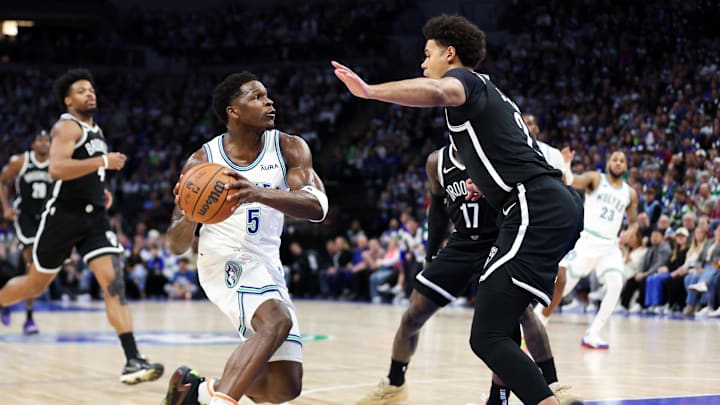 Feb 24, 2024; Minneapolis, Minnesota, USA; Minnesota Timberwolves guard Anthony Edwards (5) works towards the basket as Brooklyn Nets forward Cameron Johnson (2) defends during the first half at Target Center. Mandatory Credit: Matt Krohn-Imagn Images