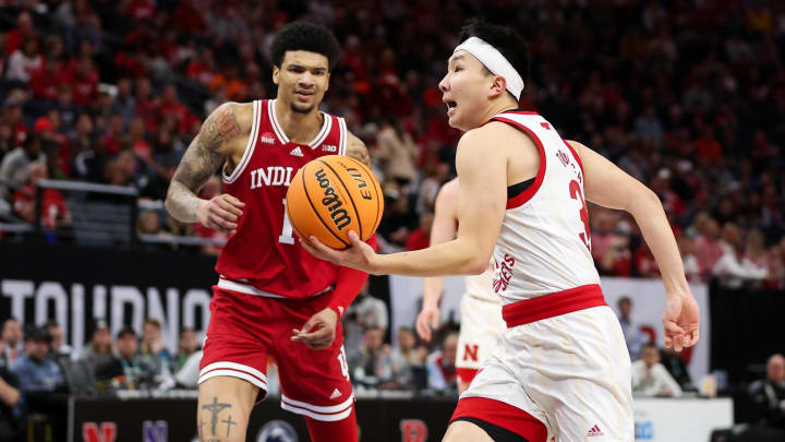 Mar 15, 2024; Minneapolis, MN, USA; Nebraska Cornhuskers guard Keisei Tominaga (30) works towards the basket as Indiana Hoosiers center Kel'el Ware (1) defends during the first half at Target Center. Mandatory Credit: Matt Krohn-USA TODAY Sports