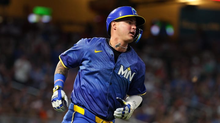 Minnesota Twins designated hitter Jose Miranda (64) hits a single setting a franchise record for 10 straight hits during the seventh against the Houston Astros inning at Target Field in Minneapolis on July 5, 2024. 