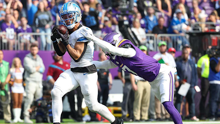 Oct 20, 2024; Minneapolis, Minnesota, USA; Detroit Lions wide receiver Amon-Ra St. Brown (14) catches a pass for a touchdown against the Minnesota Vikings during the second quarter at U.S. Bank Stadium. Oct 20, 2024; Minneapolis, Minnesota, USA; Detroit Lions wide receiver Amon-Ra St. Brown (14) catches a pass for a touchdown against the Minnesota Vikings during the second quarter at U.S. Bank Stadium.