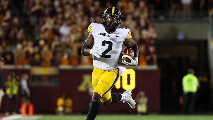 Sep 21, 2024; Minneapolis, Minnesota, USA; Iowa Hawkeyes running back Kaleb Johnson (2) runs the ball against the Minnesota Golden Gophers during the second half at Huntington Bank Stadium. Mandatory Credit: Matt Krohn-Imagn Images