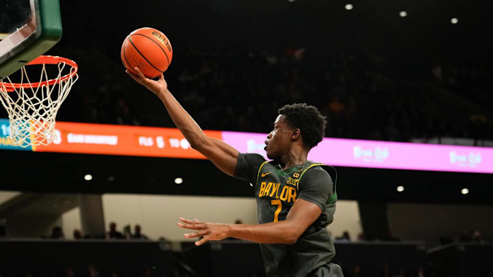 Nov 12, 2024; Waco, Texas, USA;  Baylor Bears guard VJ Edgecombe (7) drives to the basket for a layup against the Sam Houston State Bearkats during the first half at Paul and Alejandra Foster Pavilion. Mandatory Credit: Chris Jones-Imagn Images