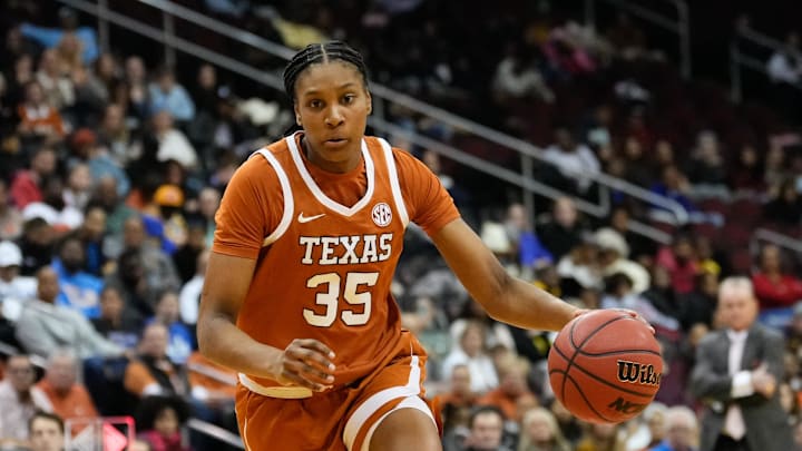 Jan 20, 2025; Newark, New Jersey, USA;  Texas Longhorns forward Madison Booker (35) drives to the basket against the Maryland Terrapins during the first half at Prudential Center. Mandatory Credit: Chris Jones-Imagn Images