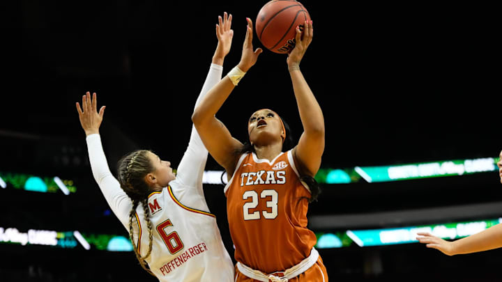 Jan 20, 2025; Newark, New Jersey, USA;  Texas Longhorns forward Aaliyah Moore (23) scores a basket against Maryland Terrapins guard Emily Fisher (3) during the second half at Prudential Center. Mandatory Credit: Chris Jones-Imagn Images