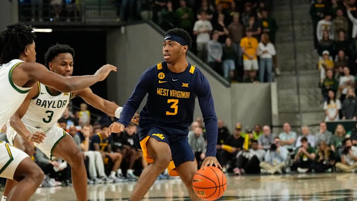 Feb 15, 2025; Waco, Texas, USA; West Virginia Mountaineers guard KJ Tenner (3) controls the ball against the Baylor Bears during the first half at Paul and Alejandra Foster Pavilion. Mandatory Credit: Chris Jones-Imagn Images