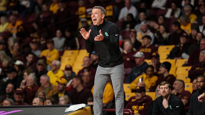 Nov 13, 2024; Minneapolis, Minnesota, USA; North Texas Mean Green head coach Ross Hodge reacts during the first half against the Minnesota Golden Gophers at Williams Arena. Mandatory Credit: Matt Krohn-Imagn Images