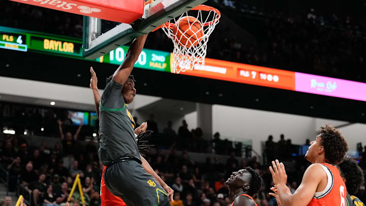 Nov 12, 2024; Waco, Texas, USA;  Baylor Bears guard VJ Edgecombe (7) dunks the ball ahead of Sam Houston State Bearkats guard Marcus Boykin (5) during the second half at Paul and Alejandra Foster Pavilion. Mandatory Credit: Chris Jones-Imagn Images