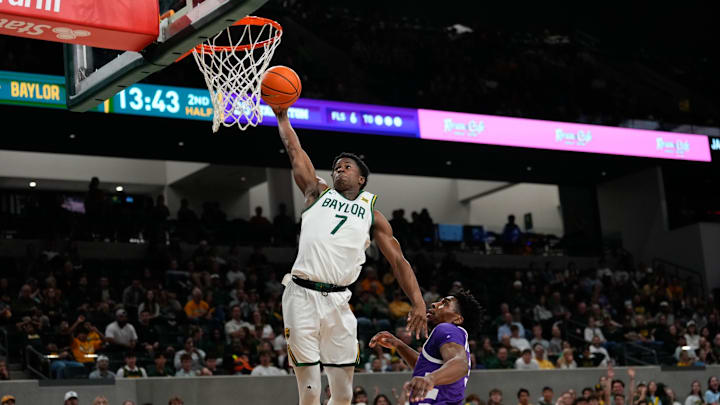 Nov 17, 2024; Waco, Texas, USA;  Baylor Bears guard VJ Edgecombe (7) dunks the ball against Tarleton Texans forward Ronnie Harrison Jr. (3) during the second half at Paul and Alejandra Foster Pavilion. Mandatory Credit: Chris Jones-Imagn Images