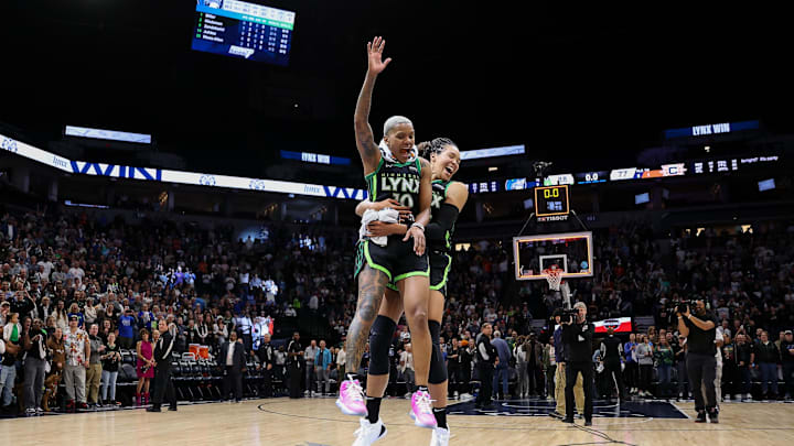 Minnesota Lynx guard Courtney Williams and forward Napheesa Collier celebrate their team's win after Game 5 of the 2024 WNBA Semifinals against the Connecticut Sun at Target Center. Mandatory Credit: Matt Krohn-Imagn Images
