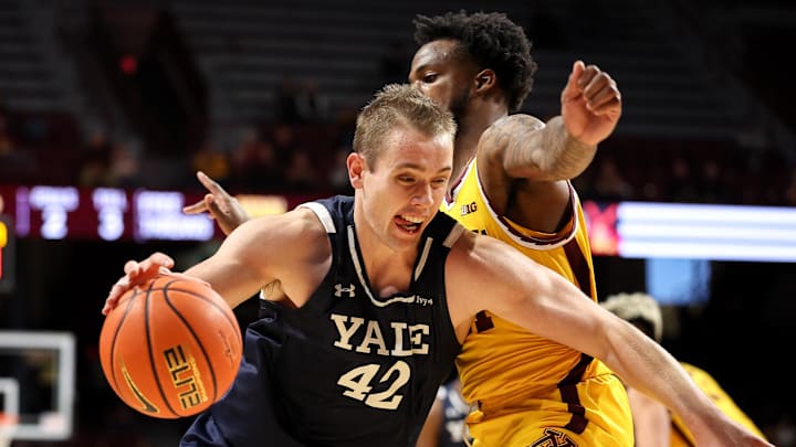 Nov 16, 2024; Minneapolis, Minnesota, USA; Yale Bulldogs forward Nick Townsend (42) works around Minnesota Golden Gophers guard Femi Odukale (11) during the second half at Williams Arena. Mandatory Credit: Matt Krohn-Imagn Images