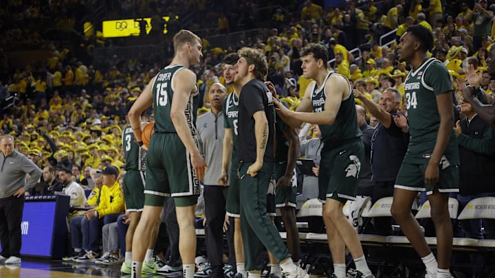 Feb 21, 2025; Ann Arbor, Michigan, USA; The Michigan State bench reacts during the second half against the Michigan Wolverines at Crisler Center. Mandatory Credit: Brian Bradshaw Sevald-Imagn Images Feb 21, 2025; Ann Arbor, Michigan, USA; The Michigan State bench reacts during the second half against the Michigan Wolverines at Crisler Center. Mandatory Credit: Brian Bradshaw Sevald-Imagn Images