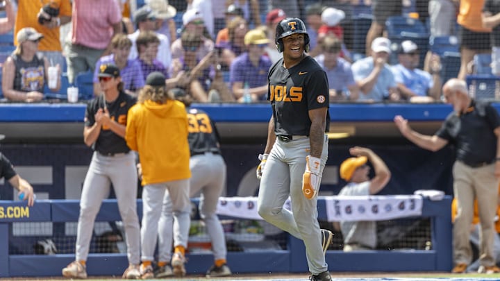 May 26, 2024; Hoover, AL, USA; Tennessee Volunteers infielder Christian Moore (1) grins as he scores on a three run home run by infielder Billy Amick (11) during the championship game between Tennessee and LSU at the SEC Baseball Tournament at Hoover Metropolitan Stadium. Mandatory Credit: Vasha Hunt-USA TODAY Sports