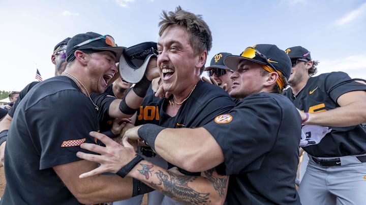 May 26, 2024; Hoover, AL, USA; Tennessee Volunteers players swarm Tennessee Volunteers pitcher Aaron Combs (28) after he got the final out of the championship win over the LSU Tigers during the championship game between Tennessee and LSU at the SEC Baseball Tournament at Hoover Metropolitan Stadium. Mandatory Credit: Vasha Hunt-Imagn Images