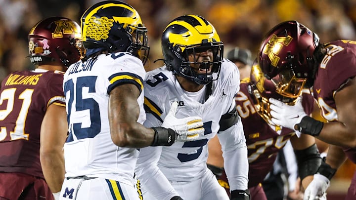 Oct 7, 2023; Minneapolis, Minnesota, USA; Michigan Wolverines defensive end Josaiah Stewart (5) celebrates a tackle against the Minnesota Golden Gophers during the second quarter at Huntington Bank Stadium.