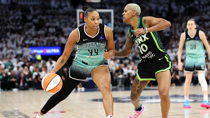 Oct 18, 2024; Minneapolis, Minnesota, USA; New York Liberty forward Betnijah Laney-Hamilton (44) drives past Minnesota Lynx guard Courtney Williams (10) during the second half of game four of the 2024 WNBA Finals at Target Center. Mandatory Credit: Matt Krohn-Imagn Images