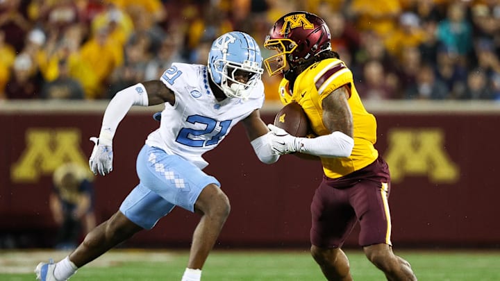 Aug 29, 2024; Minneapolis, Minnesota, USA; Minnesota Golden Gophers wide receiver Daniel Jackson (9) catches a pass as North Carolina Tar Heels defensive back Kaleb Cost (21) defends during the first half at Huntington Bank Stadium.