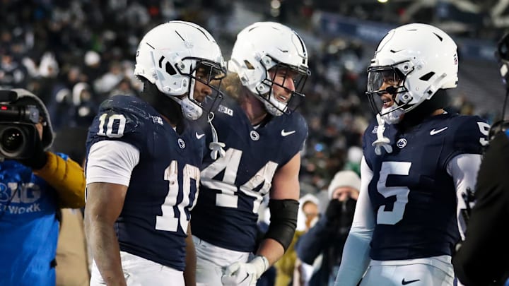 Nov 30, 2024; University Park, Pennsylvania, USA; Penn State Nittany Lions running back Nicholas Singleton (10) celebrates with teammates after scoring a touchdown against the Maryland Terrapins during the third quarter at Beaver Stadium. Penn State won 44-7. Mandatory Credit: Matthew O'Haren-Imagn Images Nov 30, 2024; University Park, Pennsylvania, USA; Penn State Nittany Lions running back Nicholas Singleton (10) celebrates with teammates after scoring a touchdown against the Maryland Terrapins during the third quarter at Beaver Stadium. Penn State won 44-7. Mandatory Credit: Matthew O'Haren-Imagn Images