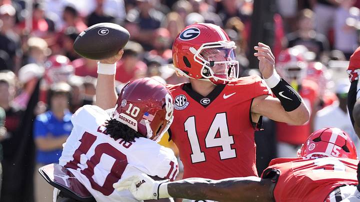 Sep 26, 2026; Athens, Georgia, USA;  Georgia Bulldogs quarterback Gunner Stockton (14) throws a pass against Oklahoma Sooners linebacker Kip Lewis (10)  during the first half at Sanford Stadium.  Mandatory Credit: Dale Zanine-Imagn Images
