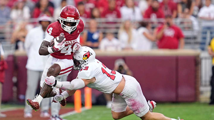 Oklahoma's Deion Burks (4) tries to get by Illinois State's Patrick Bauer (13) in the first half of the college football game between the University of Oklahoma Sooners and the Illinois State Redbirds at the Gaylord Family Oklahoma Memorial Stadium in Norman, Okla., Saturday, Aug. 30, 2025. Oklahoma's Deion Burks (4) tries to get by Illinois State's Patrick Bauer (13) in the first half of the college football game between the University of Oklahoma Sooners and the Illinois State Redbirds at the Gaylord Family Oklahoma Memorial Stadium in Norman, Okla., Saturday, Aug. 30, 2025.