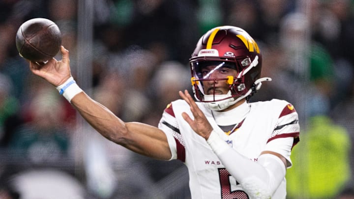 Nov 14, 2024; Philadelphia, Pennsylvania, USA; Washington Commanders quarterback Jayden Daniels (5) throws the ball against the Philadelphia Eagles during the second quarter at Lincoln Financial Field. Mandatory Credit: Bill Streicher-Imagn Images