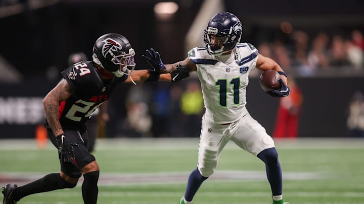 Dec 7, 2025; Atlanta, Georgia, USA; Seattle Seahawks wide receiver Jaxon Smith-Njigba (11) runs past Atlanta Falcons cornerback A.J. Terrell Jr. (24) in the first quarter at Mercedes-Benz Stadium.