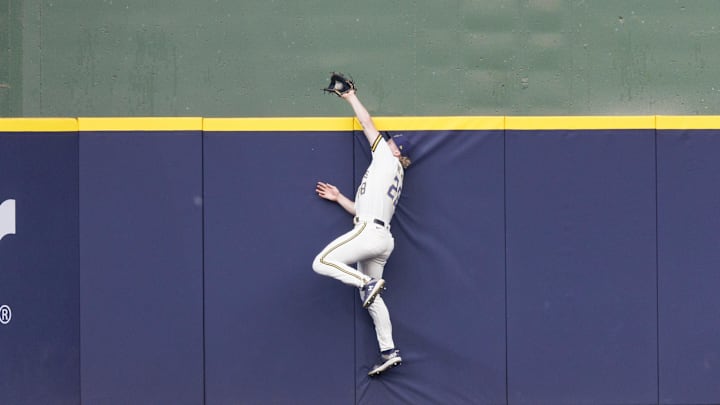 Jul 24, 2023; Milwaukee, Wisconsin, USA; Milwaukee Brewers center fielder Joey Wiemer (28) makes a leaping catch of a fly ball hit by Cincinnati Reds shortstop Elly De La Cruz (44) (not pictured) during the first inning at American Family Field. Mandatory Credit: Jeff Hanisch-Imagn Images Jul 24, 2023; Milwaukee, Wisconsin, USA; Milwaukee Brewers center fielder Joey Wiemer (28) makes a leaping catch of a fly ball hit by Cincinnati Reds shortstop Elly De La Cruz (44) (not pictured) during the first inning at American Family Field. Mandatory Credit: Jeff Hanisch-Imagn Images