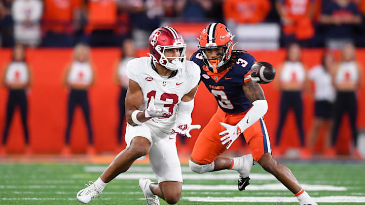 Sep 20, 2024; Syracuse, New York, USA; Stanford Cardinal wide receiver Elic Ayomanor (13) makes a catch against Syracuse Orange defensive back Clarence Lewis (3) during the second half at the JMA Wireless Dome. Mandatory Credit: Rich Barnes-Imagn Images