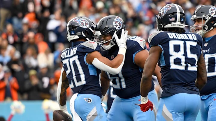 Tennessee Titans running back Tony Pollard celebrates his touchdown with offensive tackle John Ojukwu. Mandatory Credit: Steve Roberts-Imagn Images