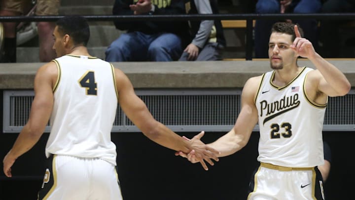 Purdue Boilermakers forward Trey Kaufman-Renn (4) high-fives Camden Heide (23) Purdue Boilermakers forward Trey Kaufman-Renn (4) high-fives Camden Heide (23)