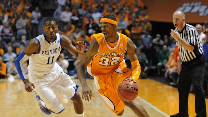 Feb 27, 2010; Knoxville, TN, USA; Tennessee Volunteers guard Scotty Hopson (32) drives against Kentucky Wildcats guard John Wall (11) during the second half at Thompson Boling Arena. The Volunteers beat the Wildcats 74-65. Mandatory Credit: Don McPeak-Imagn Images.