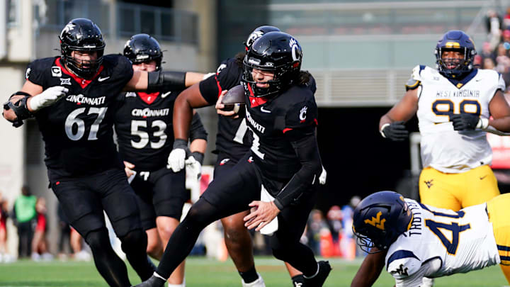 Cincinnati Bearcats quarterback Brendan Sorsby (2) runs down the field with the ball towards the end zone in the fourth quarter of a college football game between the Cincinnati Bearcats and West Virginia Mountaineers, Saturday, Nov. 9, 2024, at Nippert Stadium in Cincinnati. Mountaineers won 31-24.