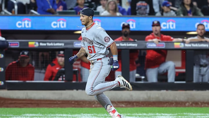 Sep 20, 2025; New York City, New York, USA; Washington Nationals designated hitter Daylen Lile (51) hits a two run inside the park home run in the eleventh inning against the New York Mets at Citi Field. 