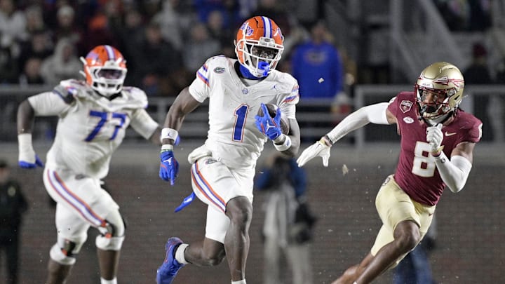 Nov 30, 2024; Tallahassee, Florida, USA; Florida Gators running back Montrell Johnson Jr. (1) runs the ball for a touchdown during the second half against the Florida State Seminoles at Doak S. Campbell Stadium. Mandatory Credit: Melina Myers-Imagn Images