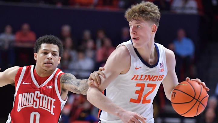 Feb 2, 2025; Champaign, Illinois, USA; Illinois Fighting Illini guard Kasparas Jakucionis (32) drives the ball past Ohio State Buckeyes guard John Mobley Jr. (0) during the first half at State Farm Center. Mandatory Credit: Ron Johnson-Imagn Images Feb 2, 2025; Champaign, Illinois, USA; Illinois Fighting Illini guard Kasparas Jakucionis (32) drives the ball past Ohio State Buckeyes guard John Mobley Jr. (0) during the first half at State Farm Center. Mandatory Credit: Ron Johnson-Imagn Images