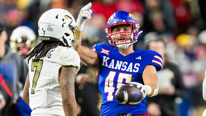 Nov 23, 2024; Kansas City, Missouri, USA;  Kansas tight end Trevor Kardell (45) gestures for a first down after a catch during the 4th quarter between the Kansas Jayhawks and the Colorado Buffaloes at GEHA Field at Arrowhead Stadium. Mandatory Credit: Nick Tre. Smith-Imagn Images
