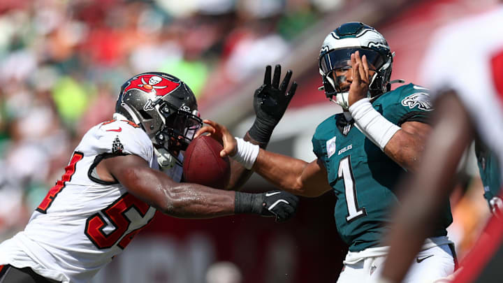 Sep 29, 2024; Tampa, Florida, USA; Tampa Bay Buccaneers linebacker Lavonte David (54) pressures Philadelphia Eagles quarterback Jalen Hurts (1) in the third quarter at Raymond James Stadium. 