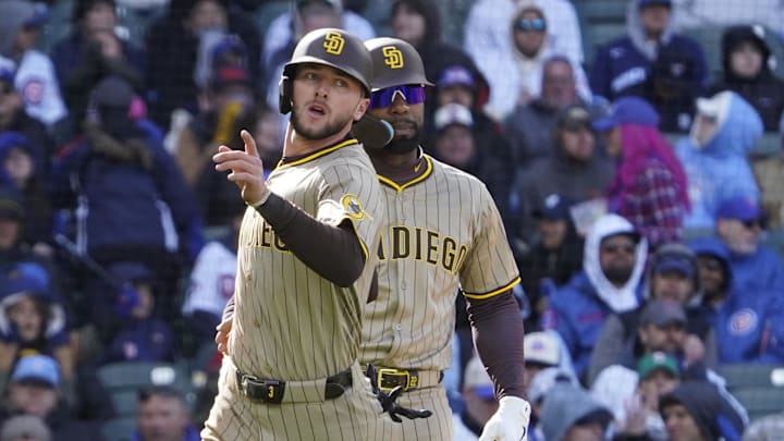 Apr 6, 2025; Chicago, Illinois, USA; San Diego Padres outfielder Jackson Merrill (3) scores and is greeted by outfielder Jason Heyward (22) against the Chicago Cubs during the eighth inning at Wrigley Field. Mandatory Credit: David Banks-Imagn Images