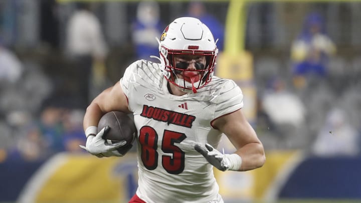Oct 14, 2023; Pittsburgh, Pennsylvania, USA; Louisville Cardinals tight end Nate Kurisky (85) runs after a catch against the Pittsburgh Panthers during the second quarter at Acrisure Stadium. Mandatory Credit: Charles LeClaire-Imagn Images Oct 14, 2023; Pittsburgh, Pennsylvania, USA; Louisville Cardinals tight end Nate Kurisky (85) runs after a catch against the Pittsburgh Panthers during the second quarter at Acrisure Stadium. Mandatory Credit: Charles LeClaire-Imagn Images