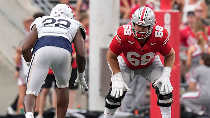 Aug 31, 2024; Columbus, OH, USA; Ohio State Buckeyes offensive lineman George Fitzpatrick (68) lines up across from Akron Zips running back Charles Kellom (22) during the NCAA football game at Ohio Stadium. Ohio State won 52-6.